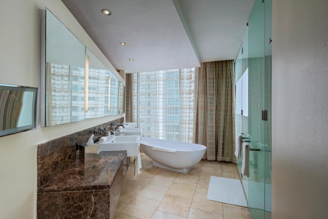 Executive suite with king bed, balcony and partial ocean view